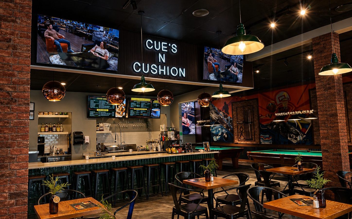 Emerald-tiled bar and booth seating at Cue's N Cushion in Delta