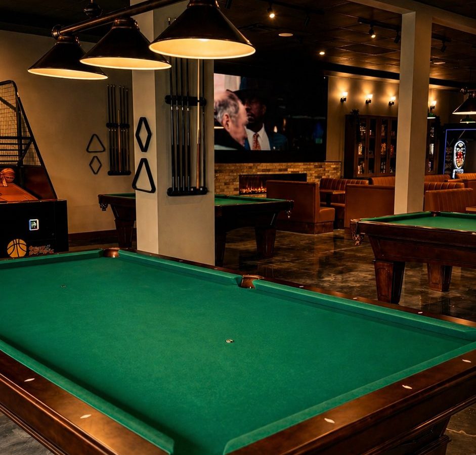 Pool table and wall cue racks at Cue's N Cushion