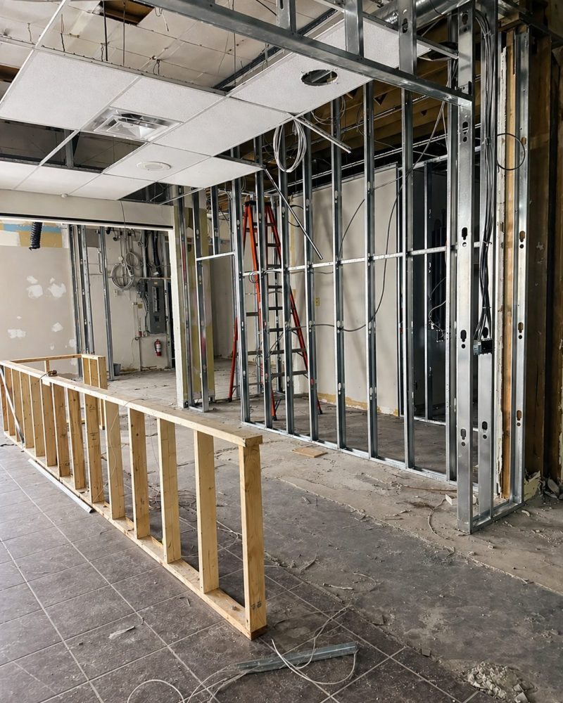 Steel stud framing during construction at Cue's N Cushion