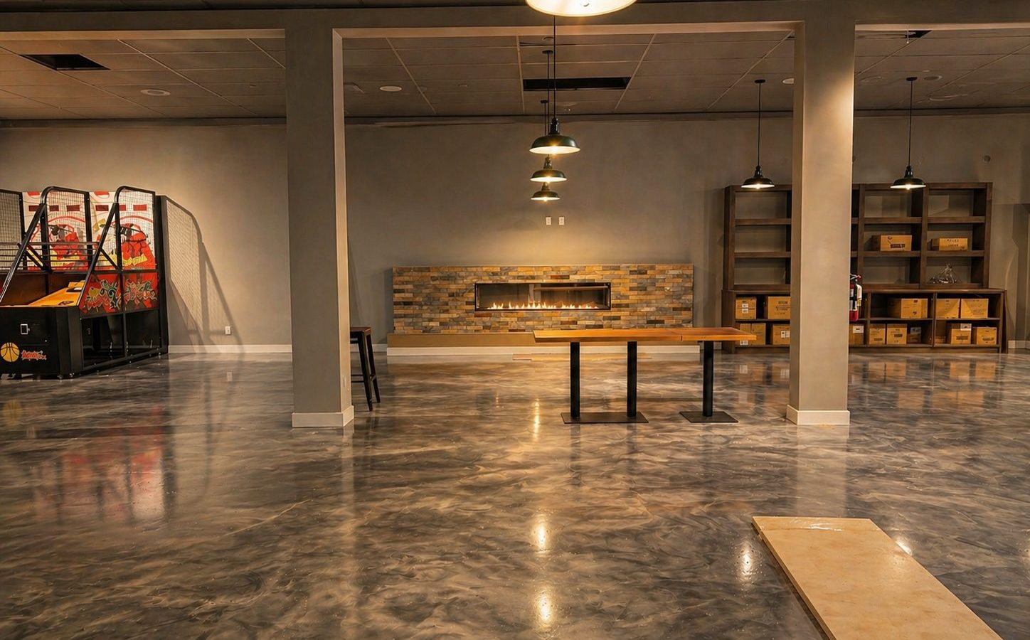 Open space with polished concrete floor before fit-out at Cue's N Cushion