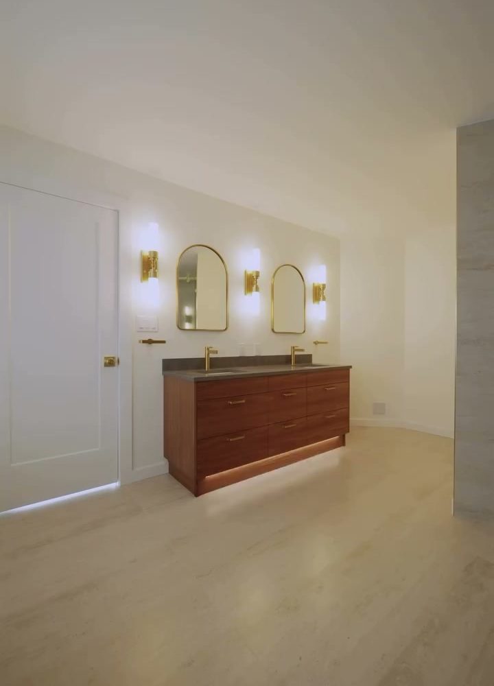 Double vanity and arched mirrors along the wall of the Port Moody ensuite
